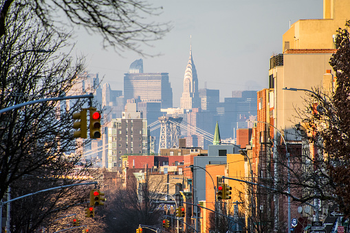 View of Manhattan from a Brooklyn street while riding in a car. New York City, New York.