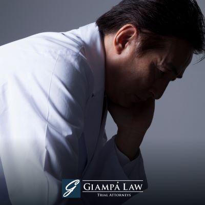 After a wrongful death due to negligence in Westchester County, a mourner sadly looking downwards