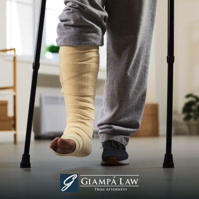 A Westchester County accident victim with a bandaged leg walking on crutches