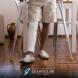 In the aftermath of a Yonkers accident, the personal injury victim stands on crutches with their leg in a cast