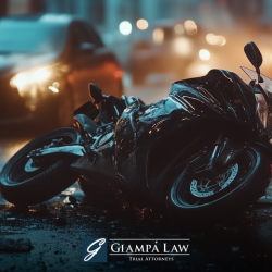 After a motorcycle accident in The Bronx, the wrecked motorcycle lays on the wet road