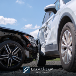 A black car in the Bronx hits a white car on its side, causing significant visible damage