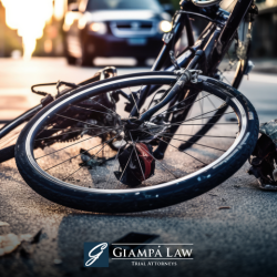 A wrecked bicycle lying on a city street after a collision with a car in The Bronx