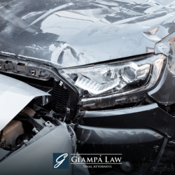 A close-up of the damage on two silver cars after a car accident in New Rochelle