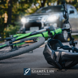 After a bicycle accident in Mount Vernon, a bike and helmet lying in the street in front of a car.