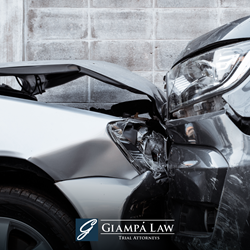 Two grey cars with crushed front ends after a car accident in The Bronx