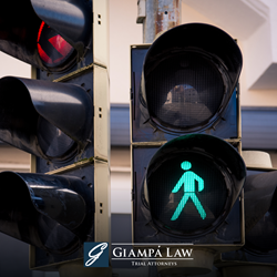 Green pedestrian walk signal illuminated next to a red light, indicating it's the pedestrian's turn to use the road